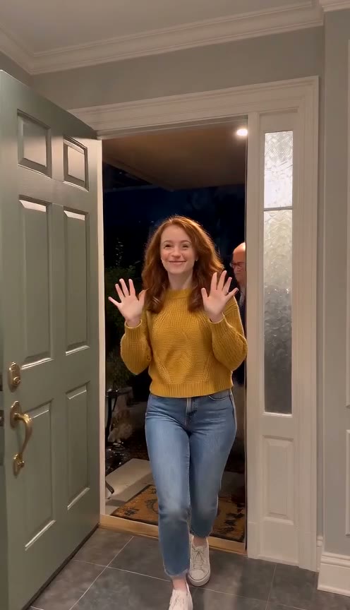 A Toc Toc AI video: friends dancing in through a front door